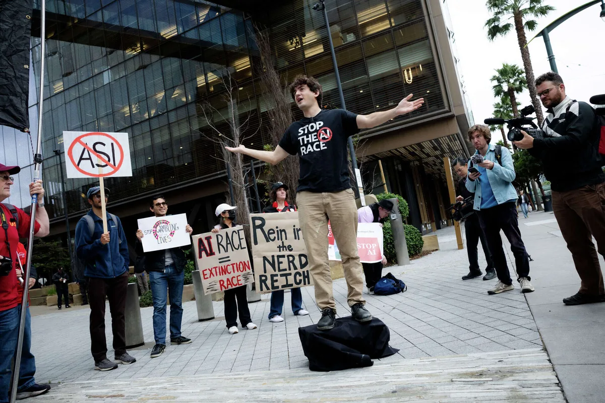 Stop The AI Race organizer Michaël Trazzi speaks to a crowd of protesters outside OpenAI headquarters in San Francisco